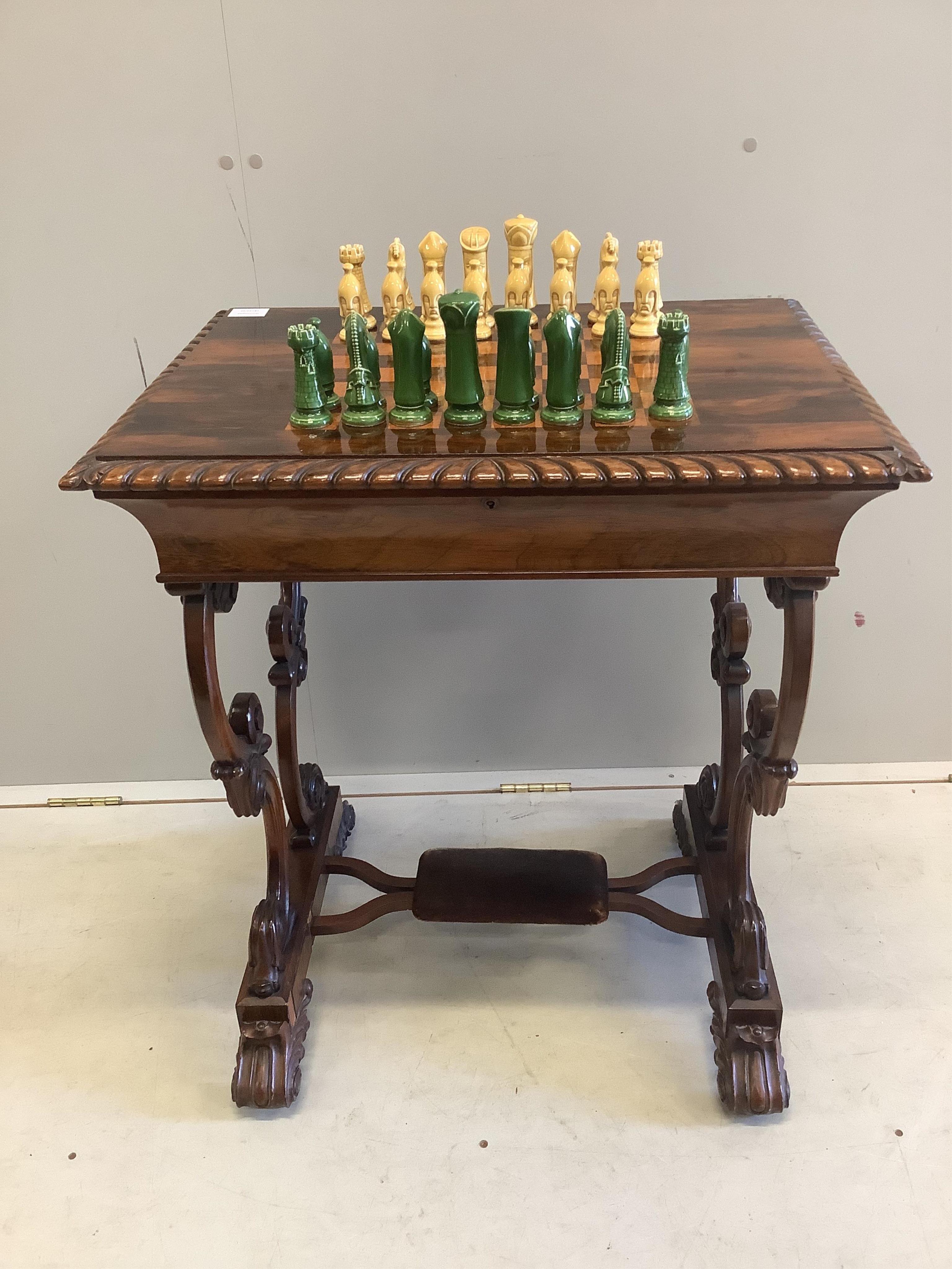 A Victorian rosewood chess top table, with chess pieces, width 66cm, depth 50cm, height 76cm